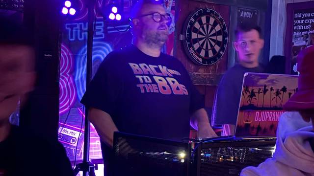 The DJ at a Back to the 80s night at Teal Farm, behind his decks